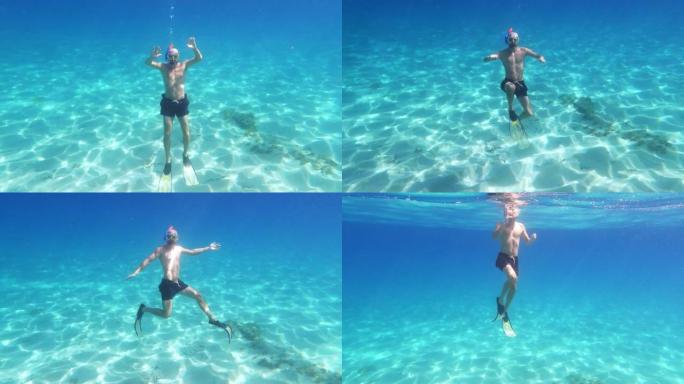 夏天在海里浮潜。男人在水里游泳和玩耍。水下射击