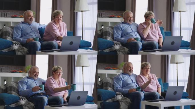 老年已婚夫妇通过在线视频聊天与朋友或孩子交流，退休人员坐在一起在家