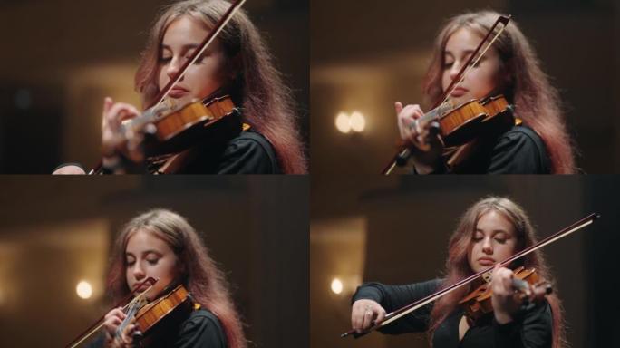 漂亮的女小提琴手在音乐厅演奏小提琴，歌剧院女小提琴手的肖像