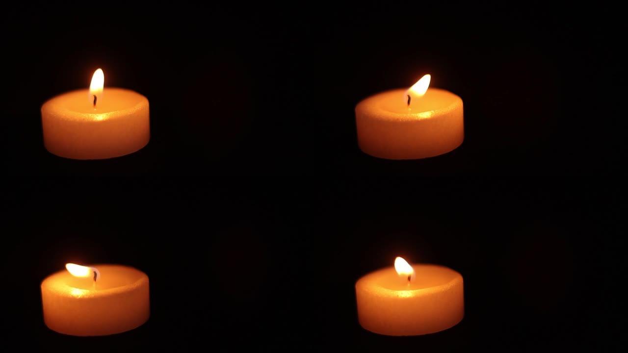 在黑暗中燃烧蜡烛