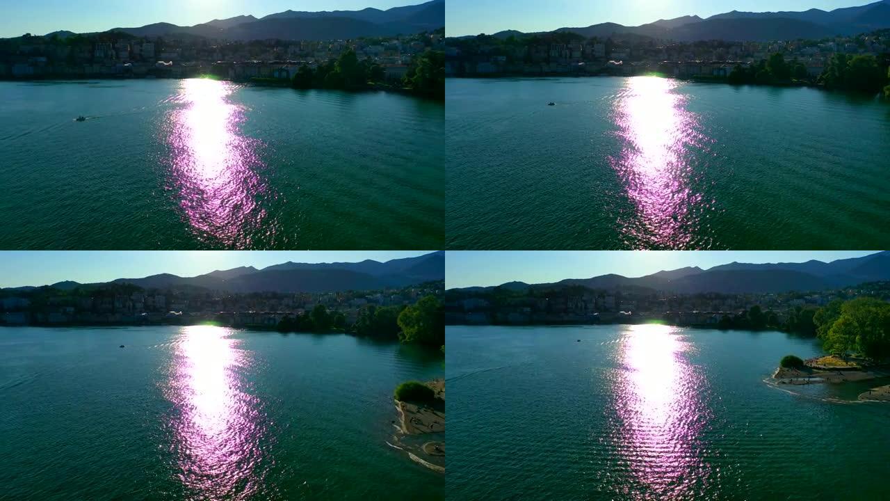 空中无人机在日出时拍摄了山上的一个湖泊