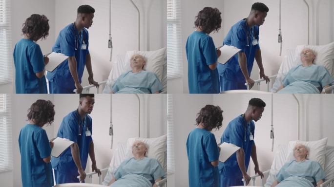 在病床上与2名非裔美国医生交谈，在医院病房，医疗保健和保险概念。医生在病床上安慰老年患者或建议诊断健