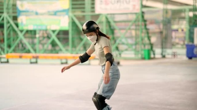 女人玩冲浪板，在高速公路下练习滑冰，她穿着防护服。