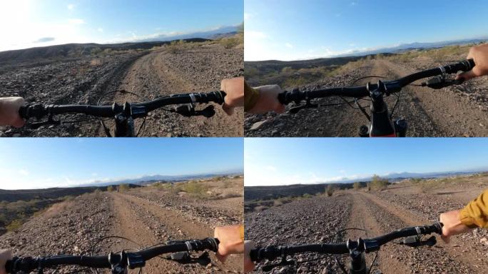沿着沙漠轨道骑自行车的第一人称视角