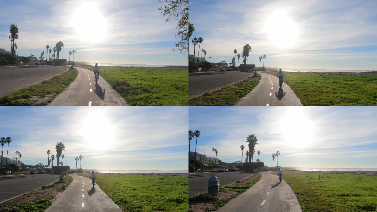 女骑自行车者遵循沿海路线