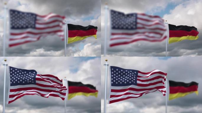 在多云的天空下，美利坚合众国和德国的旗帜