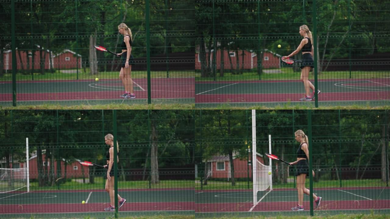 苗条的女网球运动员在夏日的露天球场上独自行走，女人在弹跳球