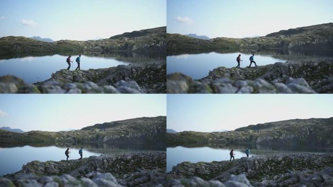 一对夫妇沿着山湖散步的镜头