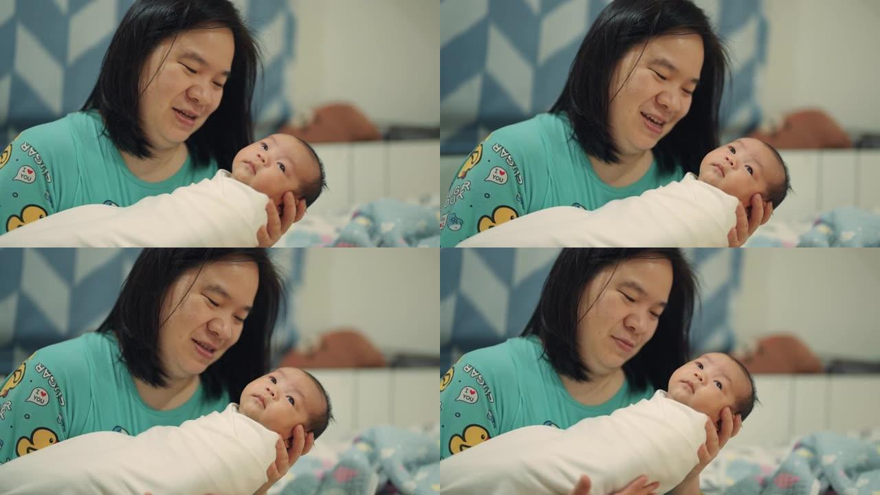 美丽的亚洲母亲与新生男婴