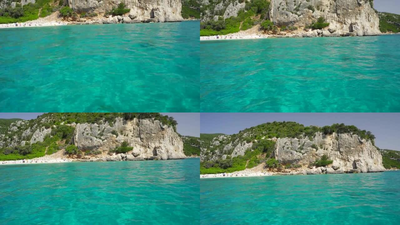 平移显示一个小岛的岩石悬崖边的镜头