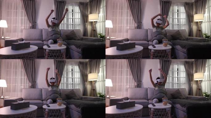 她在家中客厅通过VR眼镜观看了虚拟现实音乐会。