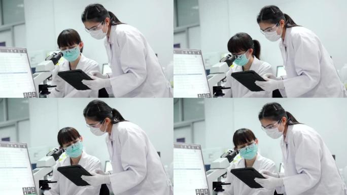 医疗技术人员使用先进的技术实验室设备检查患者的血液。