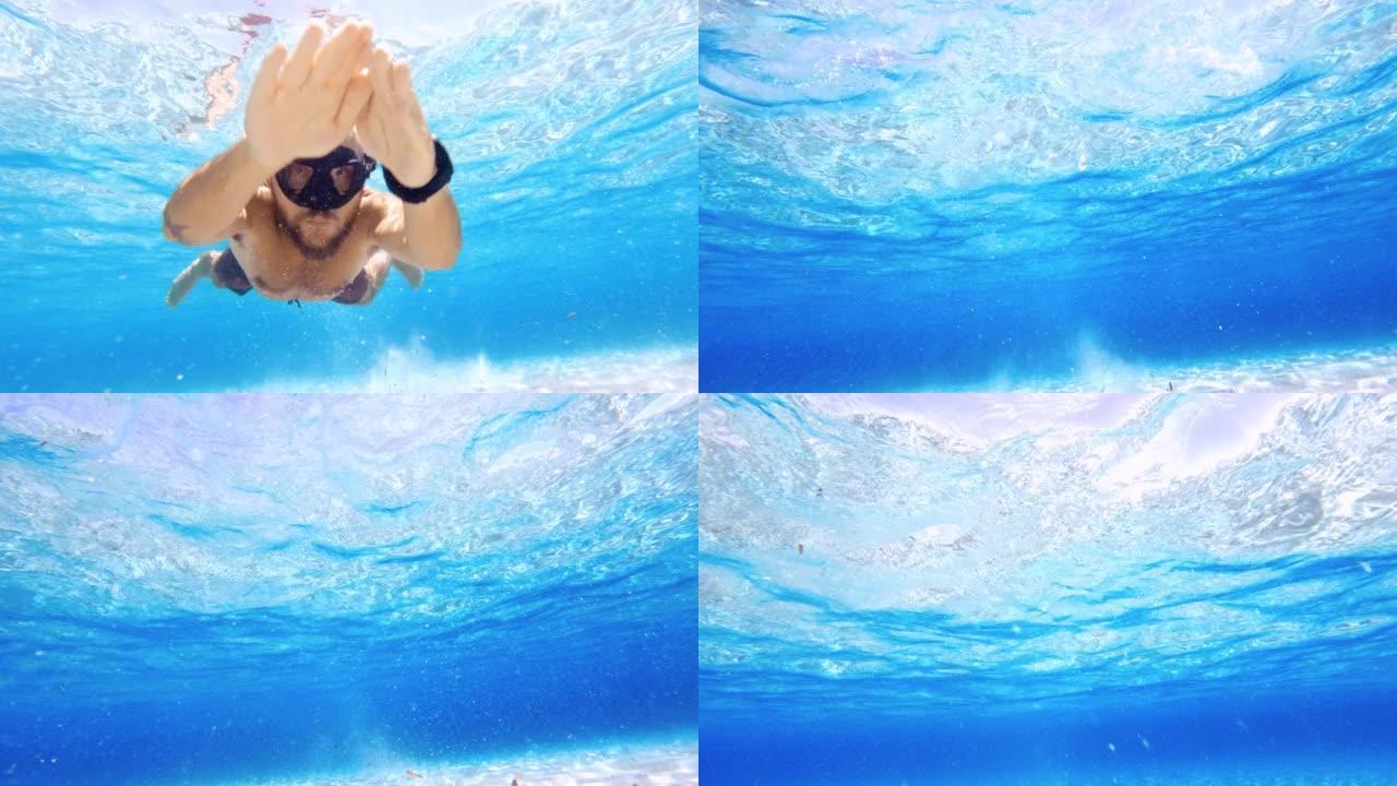 一个男人在蓝色的大海中游泳和浮潜的POV