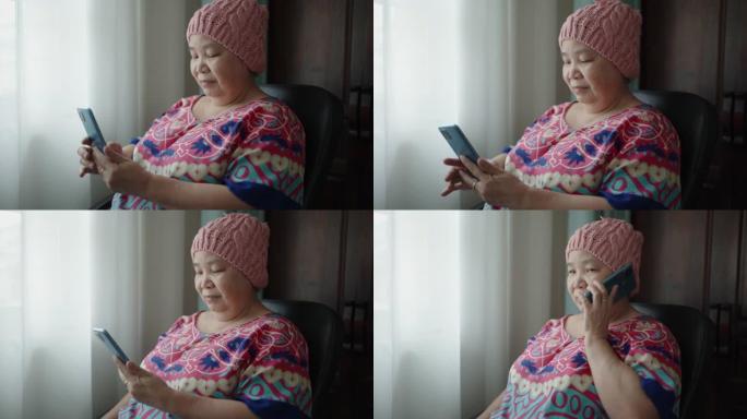 使用智能手机拍摄的亚洲癌症高级女性肖像