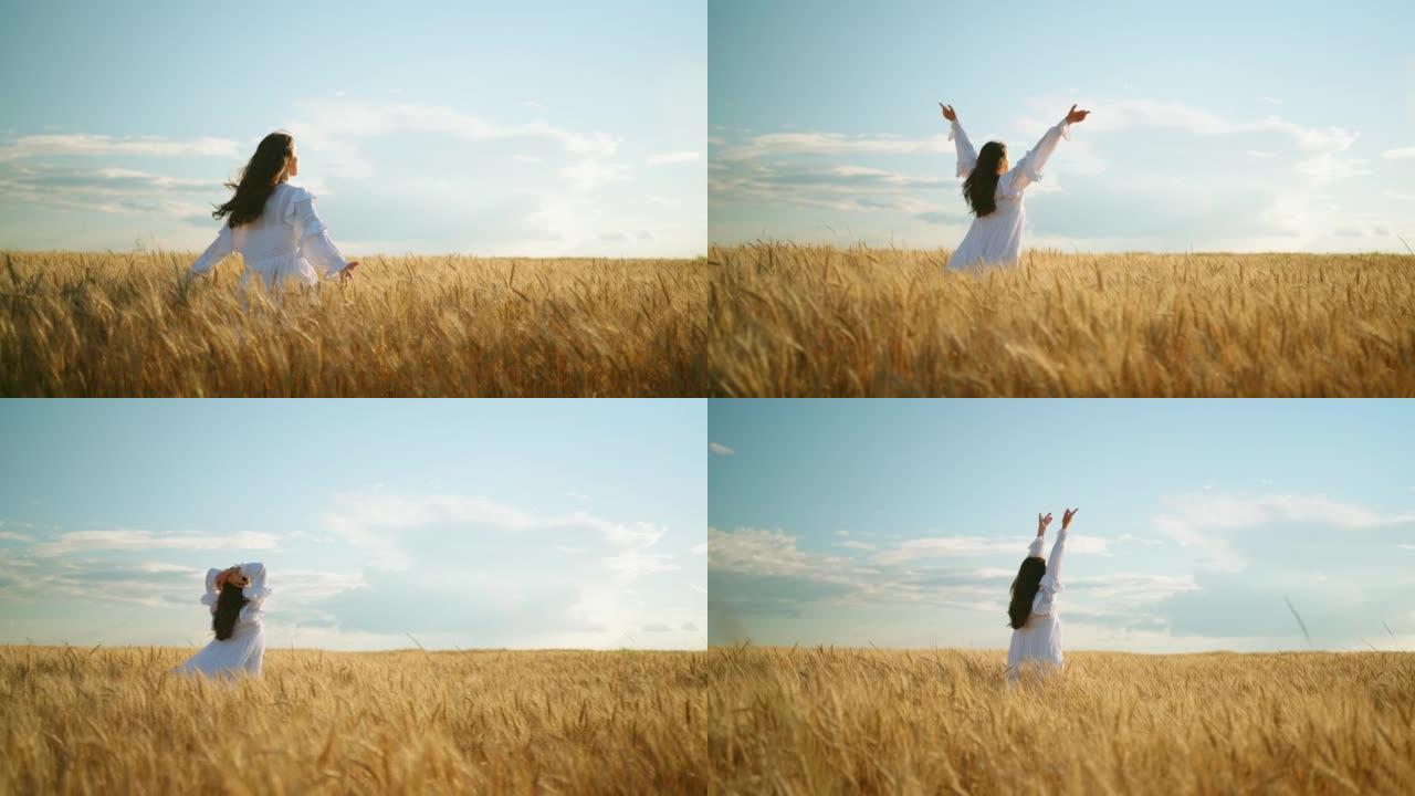 幸福和自由在金色的麦田里，女人在麦穗上奔跑，慢动作，摇曳的头发