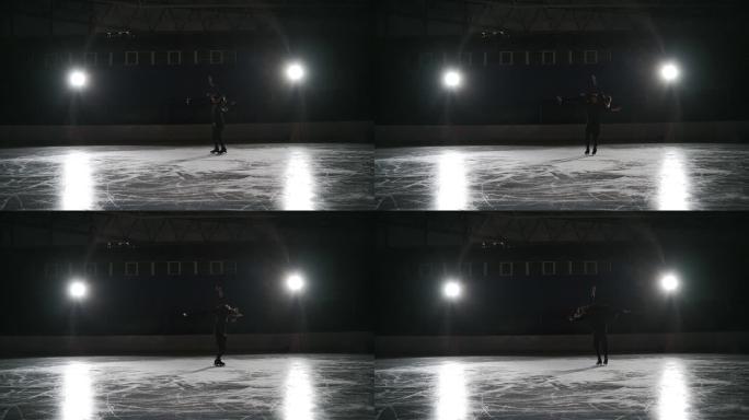 一对花样滑冰运动员的锻炼，运动员在冰上旋转进行举重，女人躺在站立的男人的肩膀上