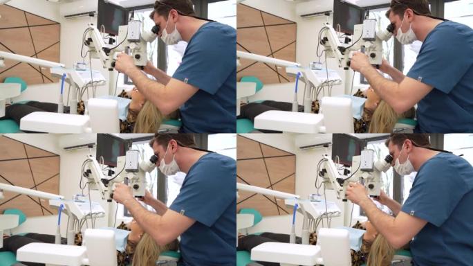 男性牙医使用牙科显微镜以获得更清晰和更好的视野