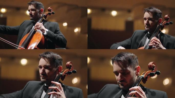 男音乐家在爱乐音乐厅演奏大提琴，古典音乐音乐会，大提琴男子肖像