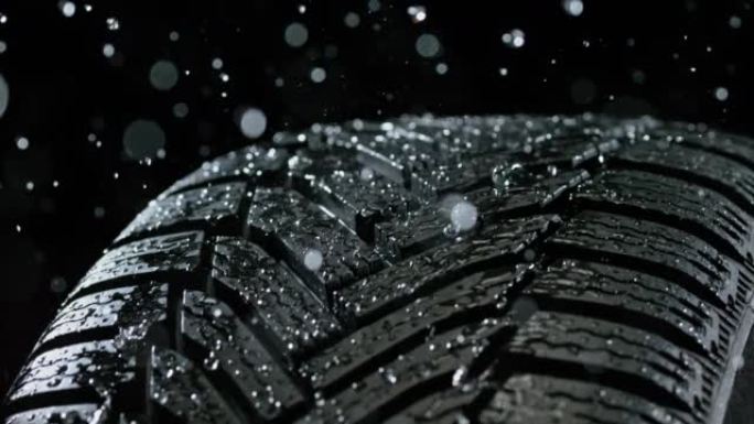 SLO MO LD雨水落在旋转汽车轮胎上