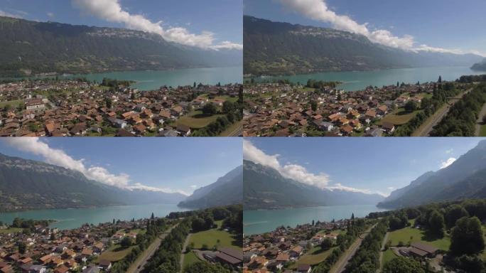 空中无人机拍摄了一个湖泊和山脉附近的高山小镇