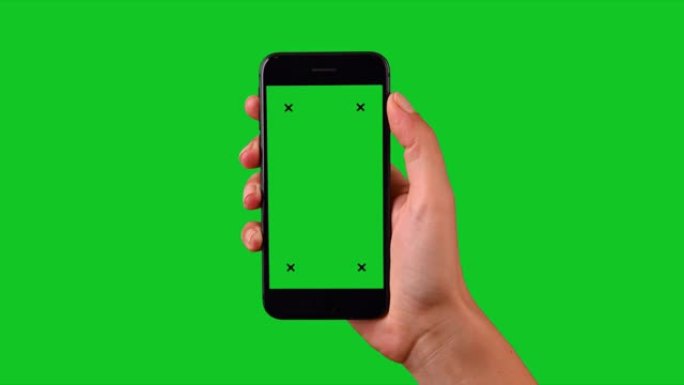 4k手使用智能手机在绿屏上显示色度键