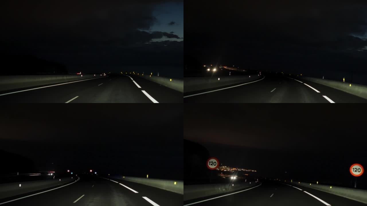 夜间在黑暗的高速公路上行驶的汽车视点