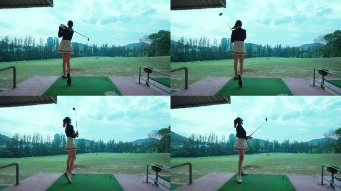 亚洲女高尔夫球手打高尔夫球开球。