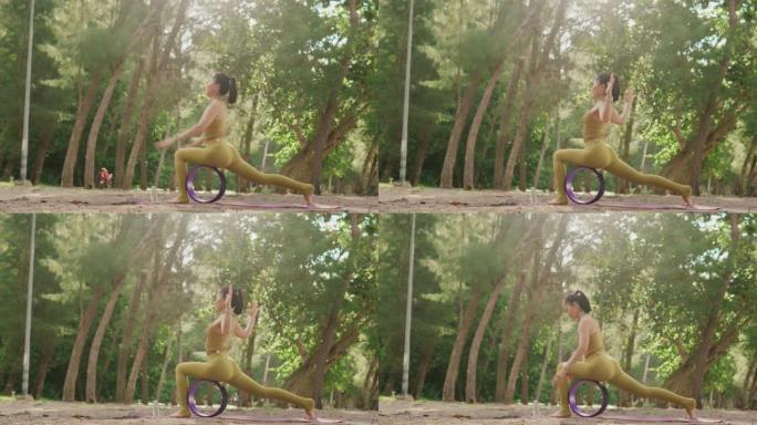 4k视频片段，一个美丽的瑜伽女人在森林海岸的晨光下，享受生活锻炼，度假，健康，旅行，生活方式