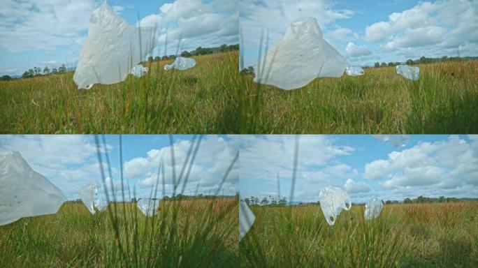 SLO MO透明塑料袋被风吹过草地