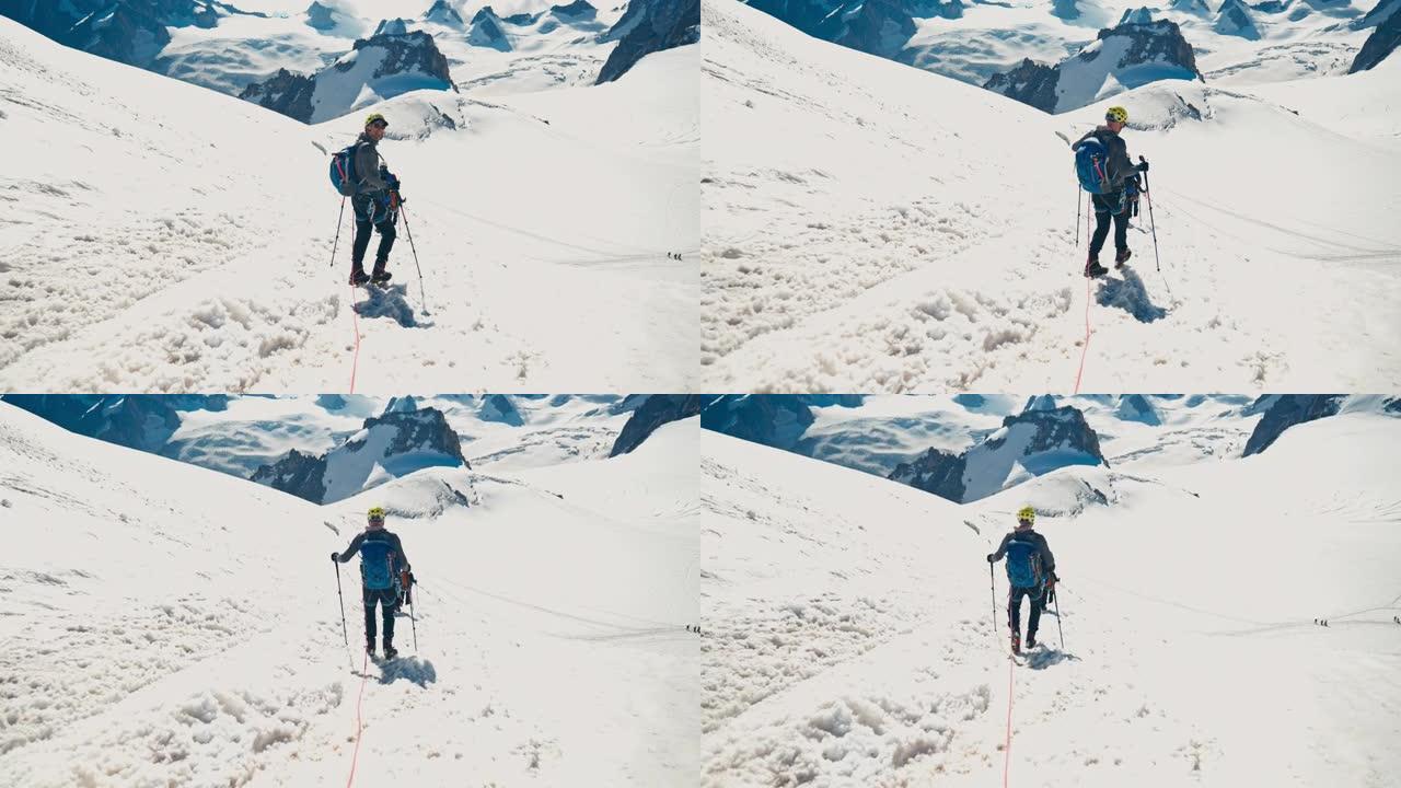 一队登山者沿着陡峭的山峰移动。冬季景观
