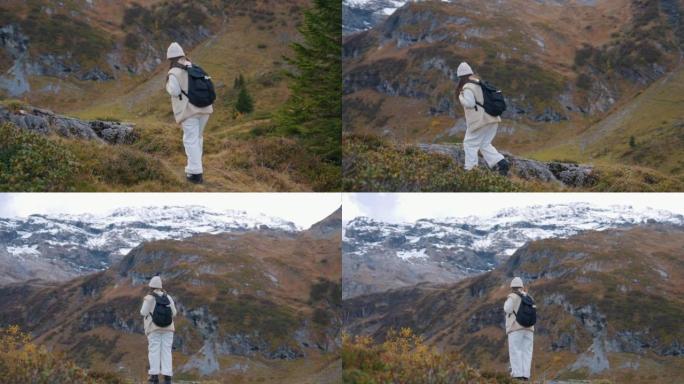 在山上行走的女人背包客翻山越岭