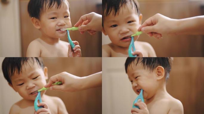 可爱的男孩自学刷牙。