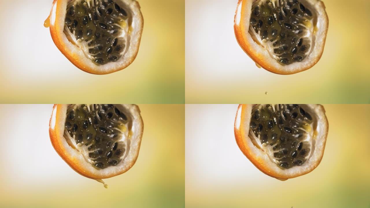 慢动作宏观拍摄来自减半的格拉纳迪拉汁的流动格拉纳迪拉汁