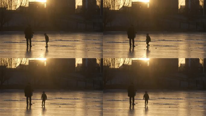 老人和儿童在夕阳下冰面的上玩耍