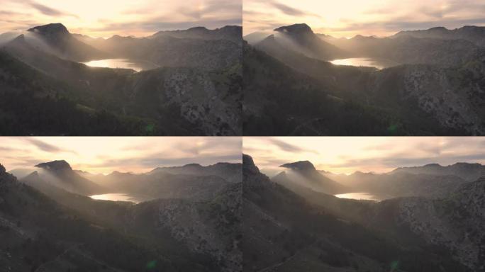 山日落的鸟瞰图。从上方看到的湖泊倒影和云