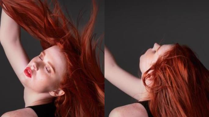美丽的红发女人，留着健康的长发。诱人的面孔。垂直视频