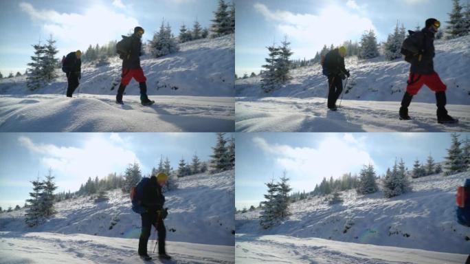 男性徒步旅行者跋涉进入冬季山区景观