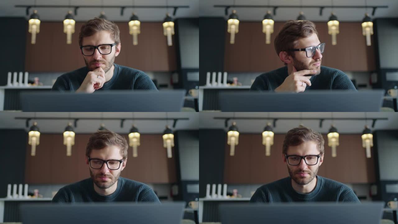 戴眼镜矫正视力的人正在观看笔记本电脑显示屏，上网和在线浏览网站
