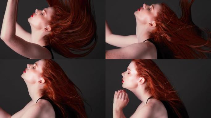美丽的红发女人，留着长长的直发，闭着眼睛。感性肖像