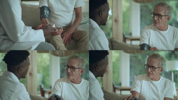 非洲族裔男医生在体检时测量老年患者的血压