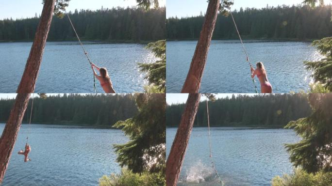 年轻女子在绳子上摆动，掉入湖中