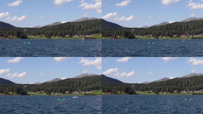 达沃斯湖人皮划艇和人帆板运动的远景