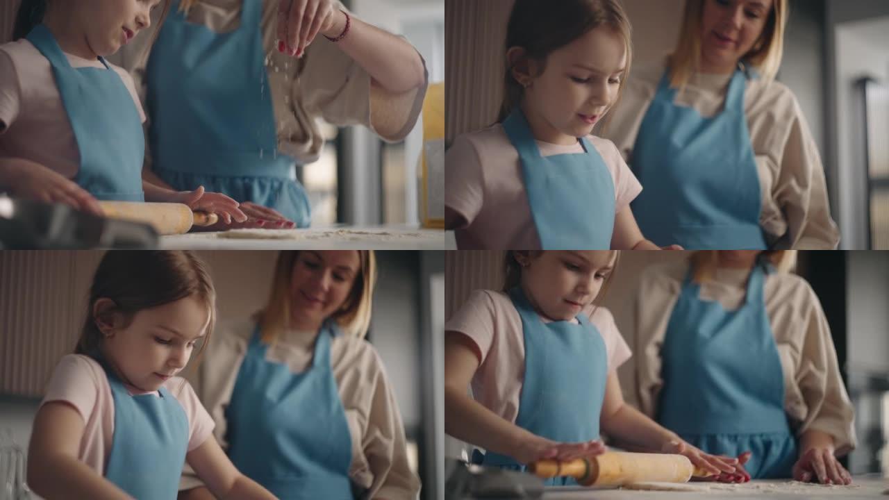 可爱的小女孩正在为馅饼铺面团，孩子正在帮助母亲在厨房做饭