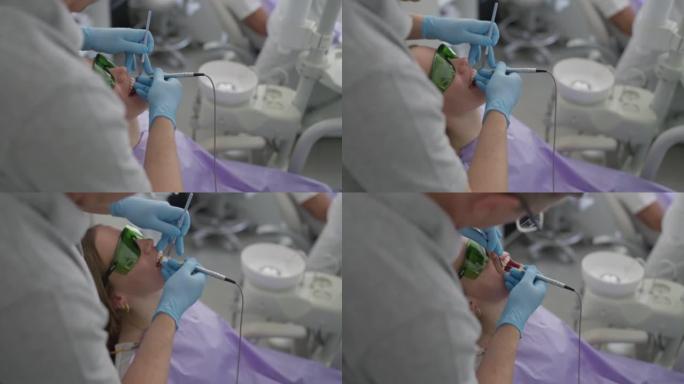 高加索男性牙医除垢女性患者牙菌斑