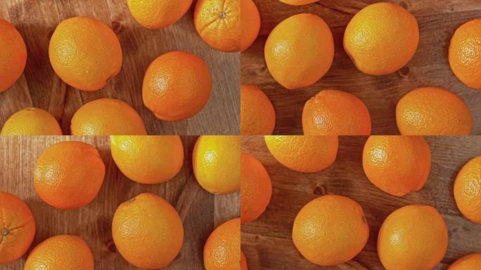 在木桌上旋转的慢动作橘子