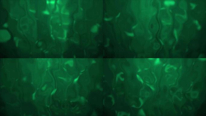 4k背景抽象模糊的绿松石，背景中发生液化。熔化彩色玻璃效果股票视频。缓慢溶解并流下液体抵抗光束