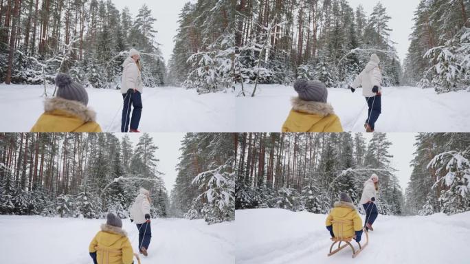 快乐的女人和她的小儿子穿着旧的木制雪橇在冬天在森林里散步