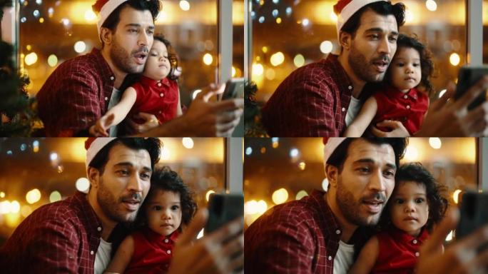 快乐的爸爸和一个可爱的女孩，享受与家人交谈的视频通话，并在家中圣诞快乐。