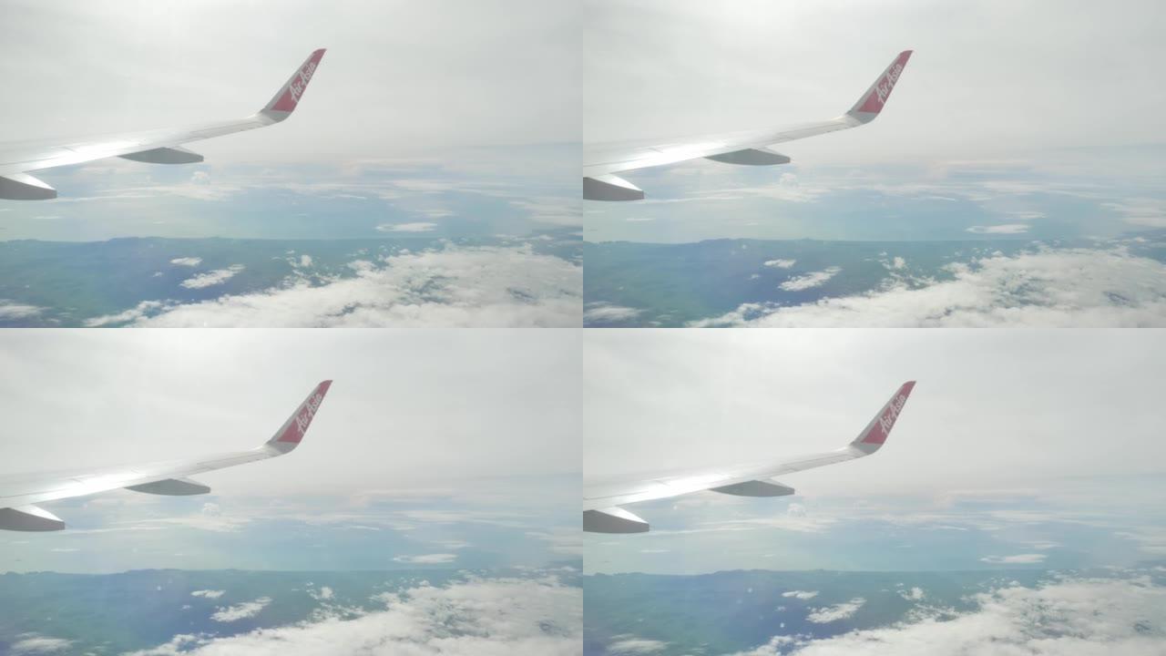 通过飞机窗口飞行的airaisa空中客车a320飞机机翼的视图