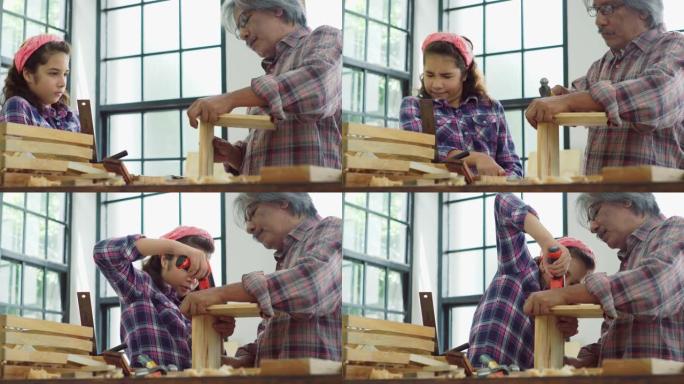木工教学车间。爷爷和孙女在细木工。